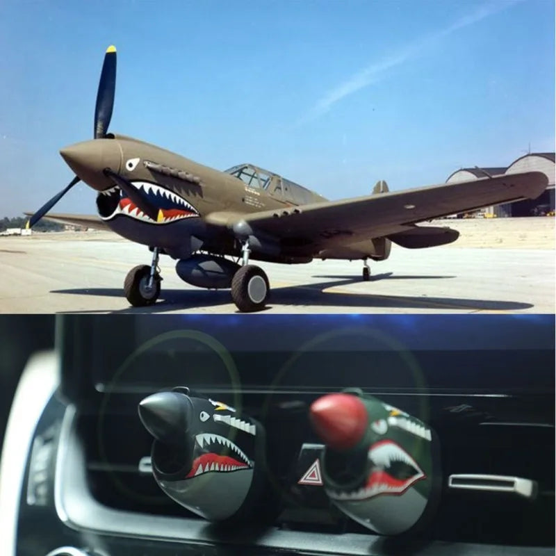 P-40 fighter car air freshener, tribute to mechanical classics. Eye-catching propeller design, ideal gift.